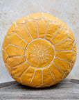 Mustard yellow Moroccan leather pouf front view