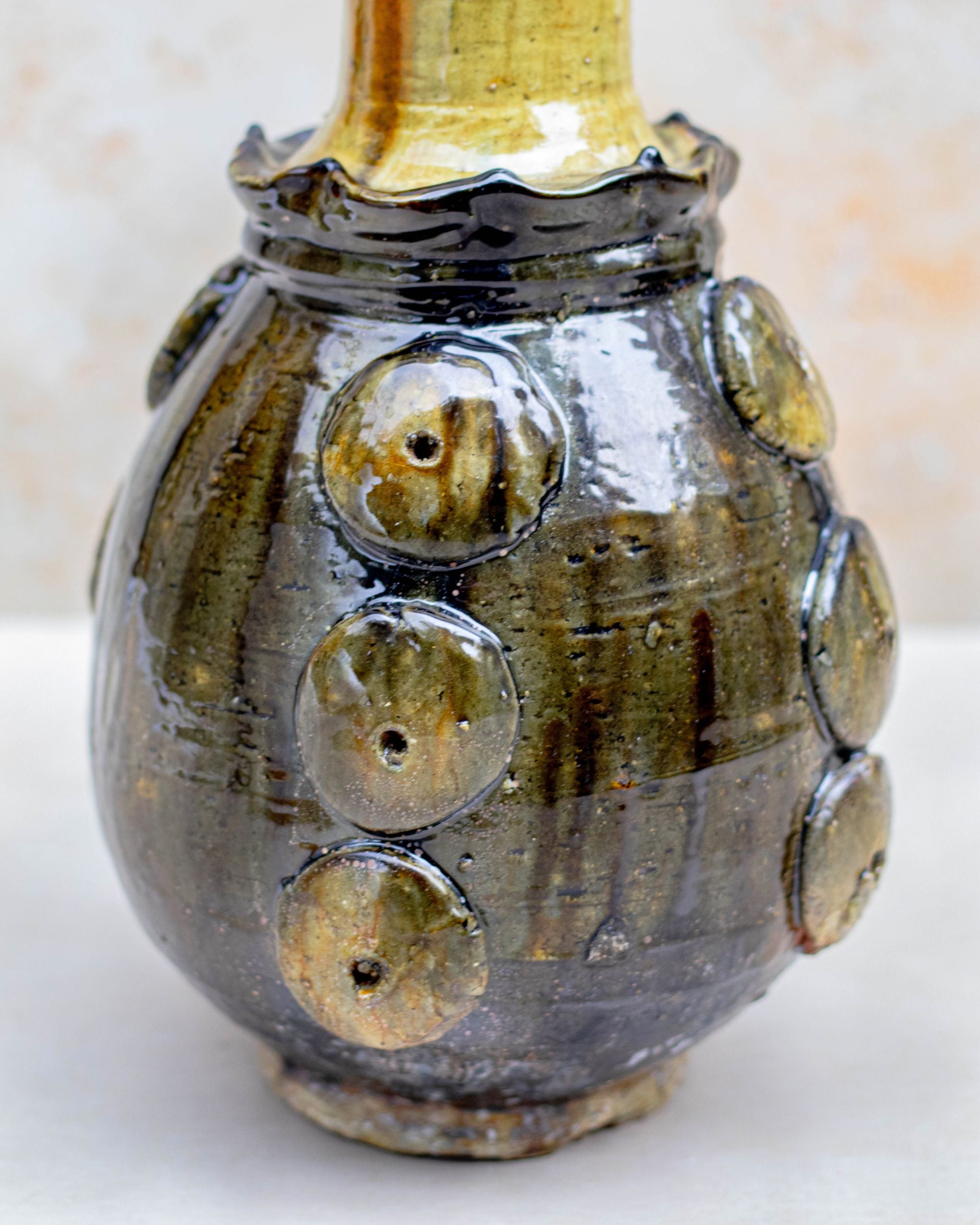 Ochre and brown glazed vase with tall neck