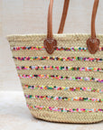 Palm leaf basket – close-up of multicoloured stitching