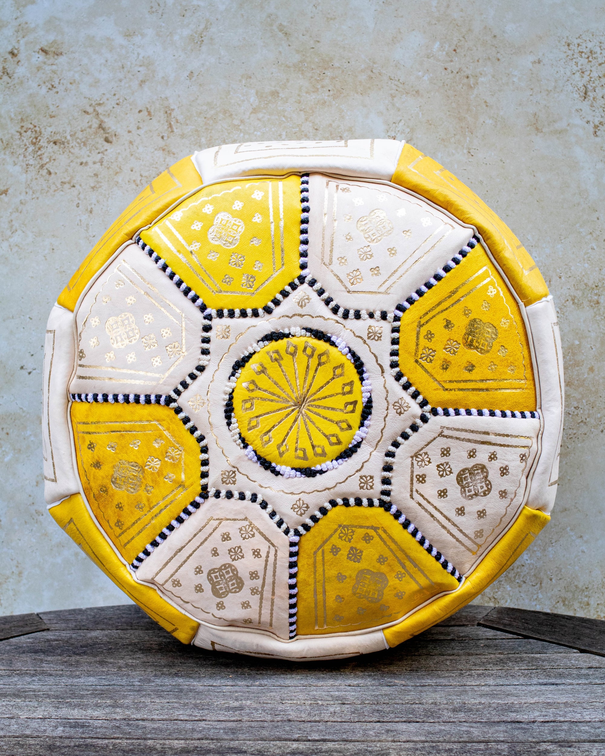 Yellow and cream Moroccan leather pouf with gold embroidery front view
